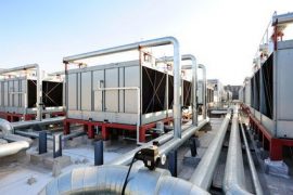 Sets of cooling towers in data center building.